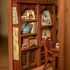 Miniature music room book nook interior with a tiny bookshelf, framed art, and chair for a lamplit shelf diorama SZ003