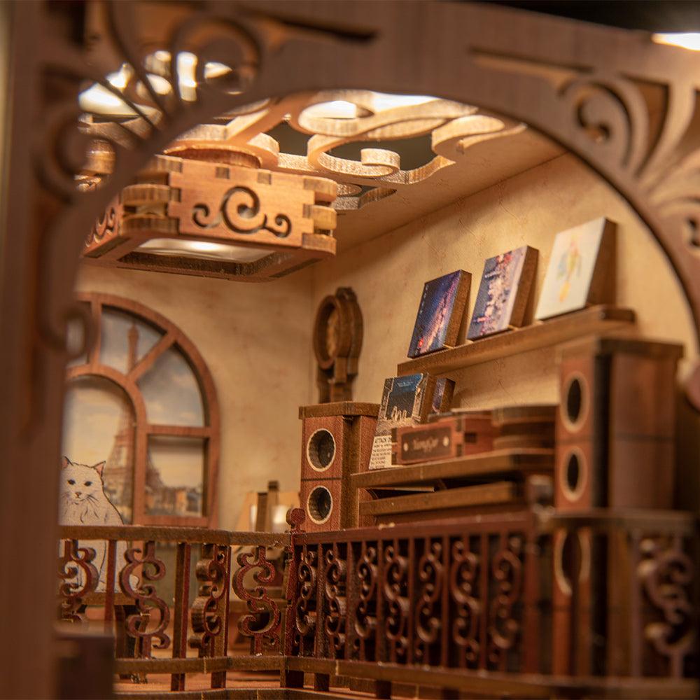 Miniature diorama book nook interior with a carved balcony, records, and warm lamps for a music-themed shelf scene SZ003