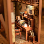 Book nook kit interior with a tiny desk, lamp, and books as a hand-built miniature music study diorama for shelves SZ003
