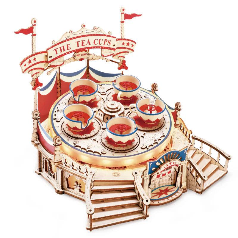 Tilt-A-Whirl music box 3D wooden puzzle with spinning teacups and a rotating carousel, a mechanical model kit for adults