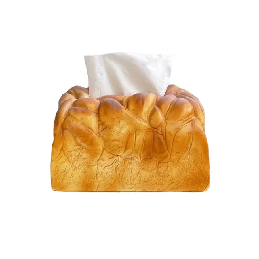 Realistic toast bread tissue box holder shaped like a golden loaf that turns a plain tissue box into quirky home decor
