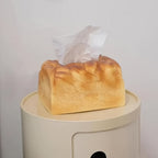 Novelty toast tissue box holder with an acrylic base that lifts open so you can swap a new tissue box in seconds