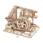 Trapdoor Tactician wooden marble run kit with 233 laser-cut pieces and 10 marbles, a build-it-yourself STEM machine