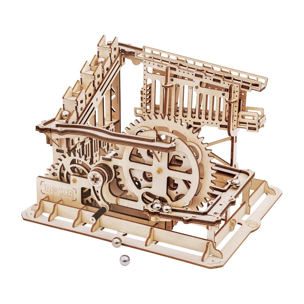 Trapdoor Tactician wooden marble run kit with 233 laser-cut pieces and 10 marbles, a build-it-yourself STEM machine