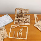 Laser-cut wooden part sheets ready to assemble into a 233 piece marble run, a build project for hobbyists and STEM students