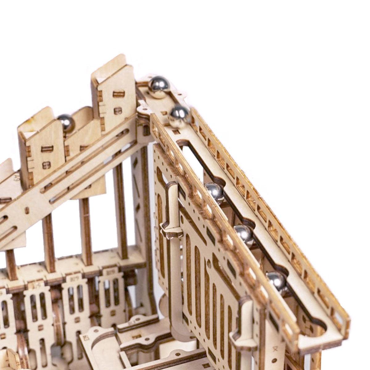 Stair stepper elevator and straight rails guiding marbles along the track, a kinetic marble machine for hands-on STEM play