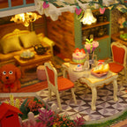 Cozy resort living and dining room with a golden sofa, tea set, dining table and a little poodle in a handmade miniature kit