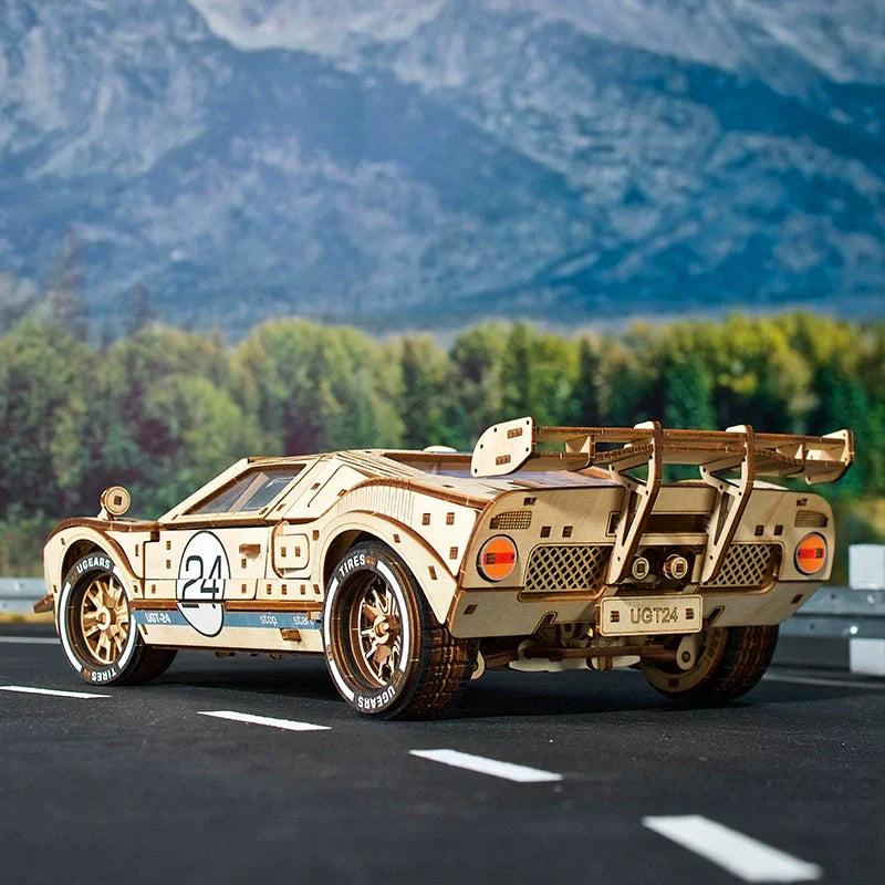Wooden race car model showing its mechanical chassis and moving parts, an interlocking endurance racer kit for motorsport fans