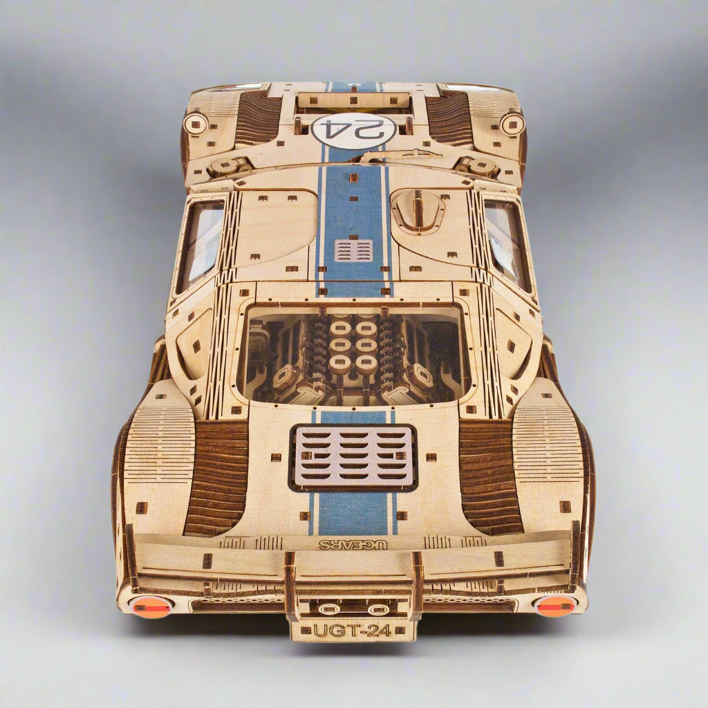 Assembled wooden racer with warm wood grain finish as office and desk decor, a 3D mechanical model car kit for hobby collectors