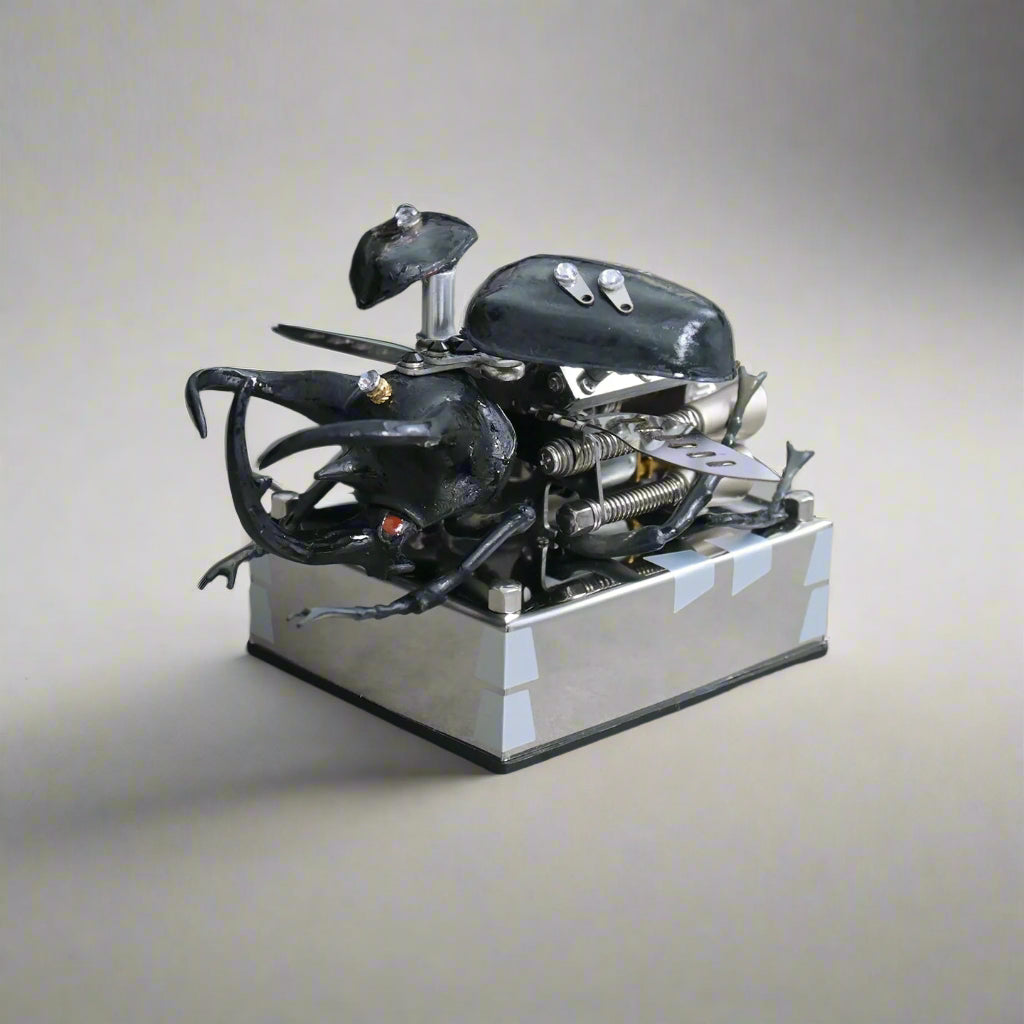 Zinc alloy metal puzzle that builds a detailed beetle with pistons and gears for engineering hobbyists
