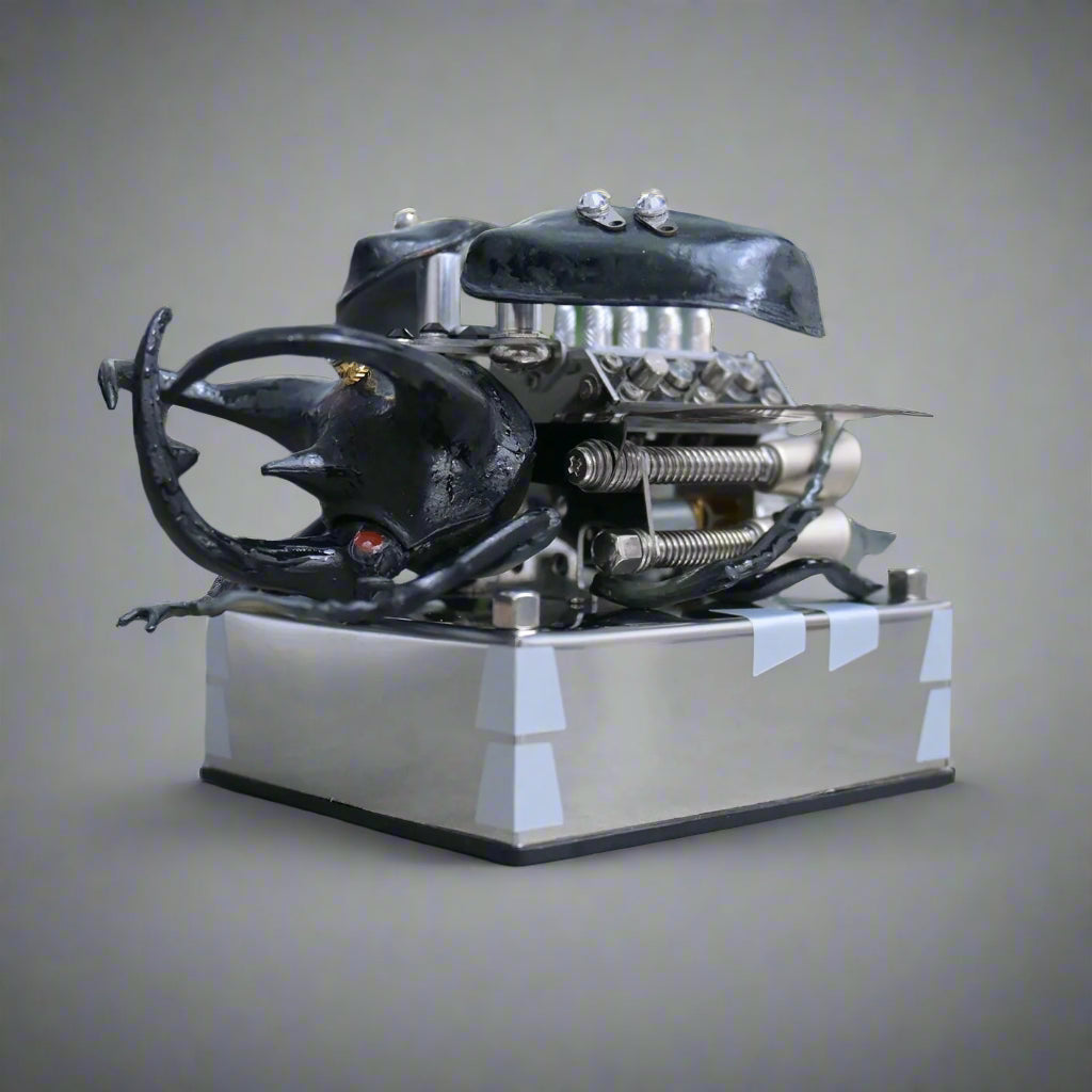 Hands on metal beetle assembly kit with internal engine detail for desk display and collectible building