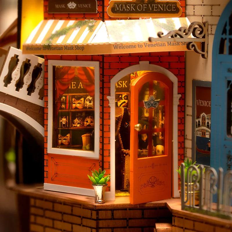 Miniature Venice shelf insert with built-in LED lights and canal buildings, a snap-together gift for readers
