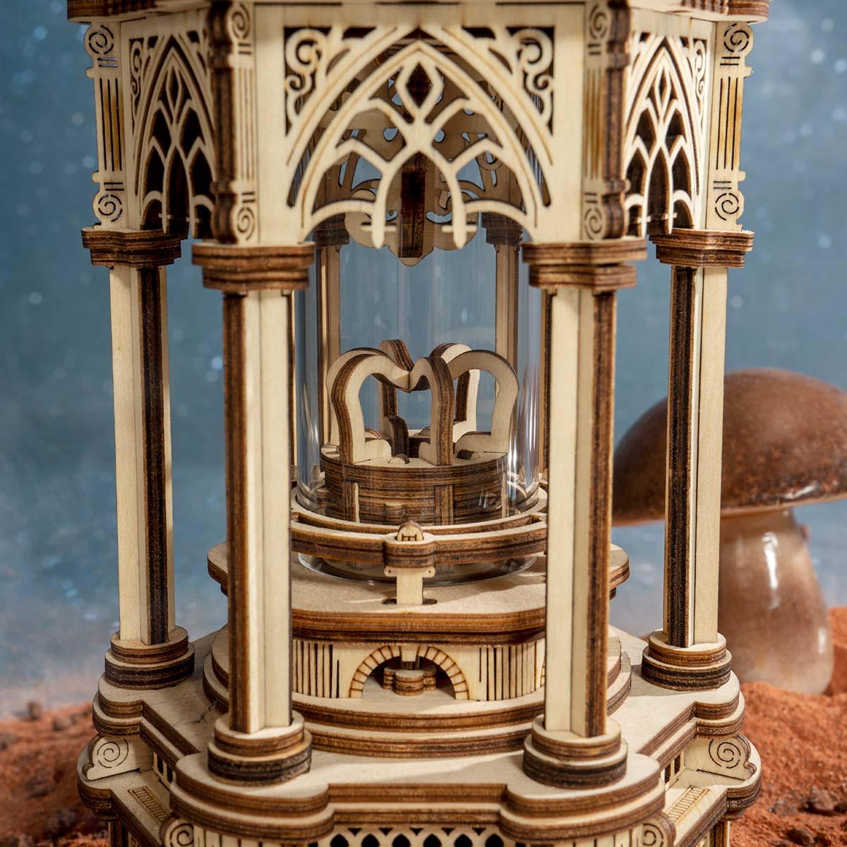 Illuminated Victorian pavilion lantern built from 210 wooden pieces, a mechanical music box night light for hobbyists