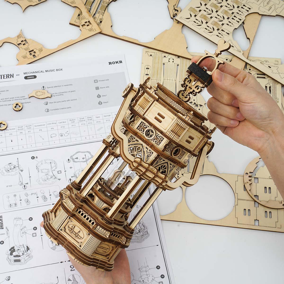 Build your own wind-up lantern music box, a 3D wooden puzzle kit that glows and plays a melody as a birthday gift