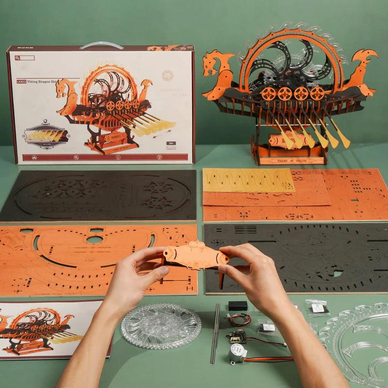 149-piece laser-cut wood assembly kit with printed board sheets and wiring for a build-your-own Viking dragon longship
