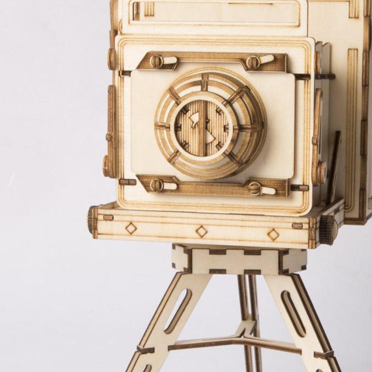 Retro camera wooden model kit with a laser cut lens and folding bellows, an easy no glue build for hobby crafters and teens