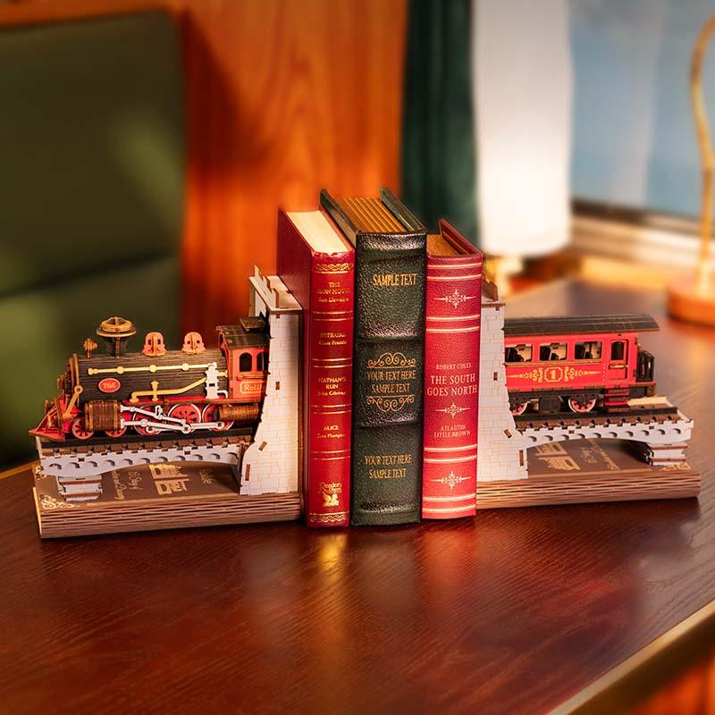 Wooden train bookends styled on a reading desk, a vintage steam engine book end set that frames books as a shelf accent