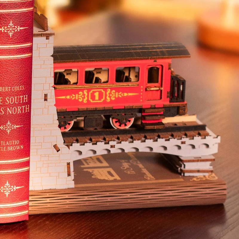 Red passenger carriage book end on a laser cut bridge, a vintage railway train set and gift for train enthusiasts