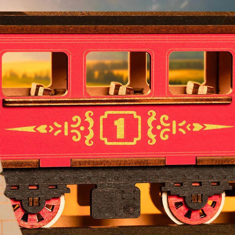 Vintage railway carriage with lit windows and a gold number one crest, a wooden train bookend accent for offices and desks