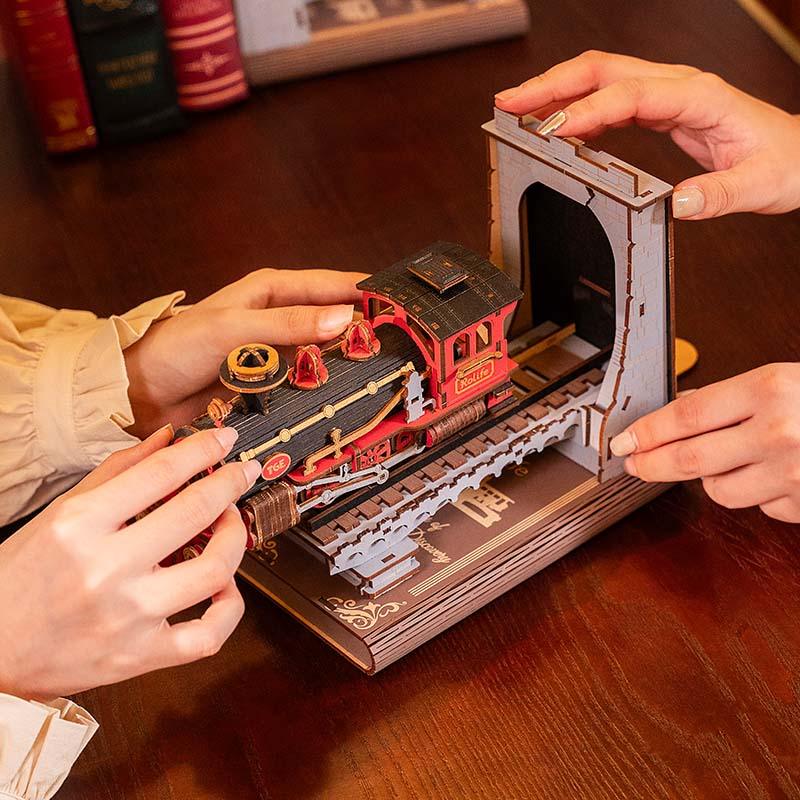 Assembling the wooden train bookend kit by hand with bayonet locking parts, a tool free 3D puzzle craft for hobbyists