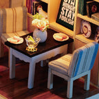 Detailed 1:24 dollhouse room with layered furnishings and warm lighting for a handcrafted display piece