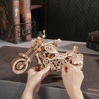 Hands on assembly of the cruiser motorcycle kit with interlocking wooden parts, a relaxing DIY model project for adults