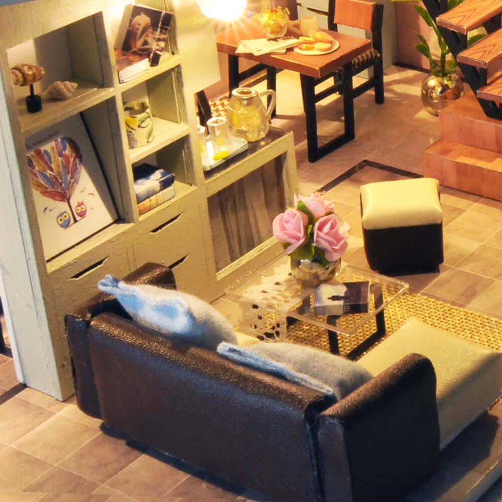 Miniature living room with a leather sofa, coffee table and bookshelf, a warm LED room box for desk or shelf decor