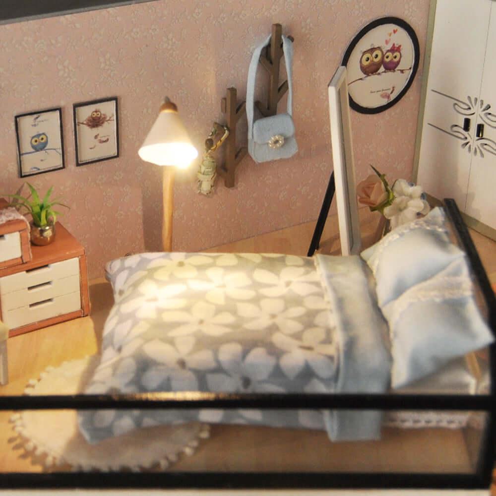 Handcrafted miniature bedroom with floral bedding and a reading lamp, a wooden dollhouse gift for miniature fans