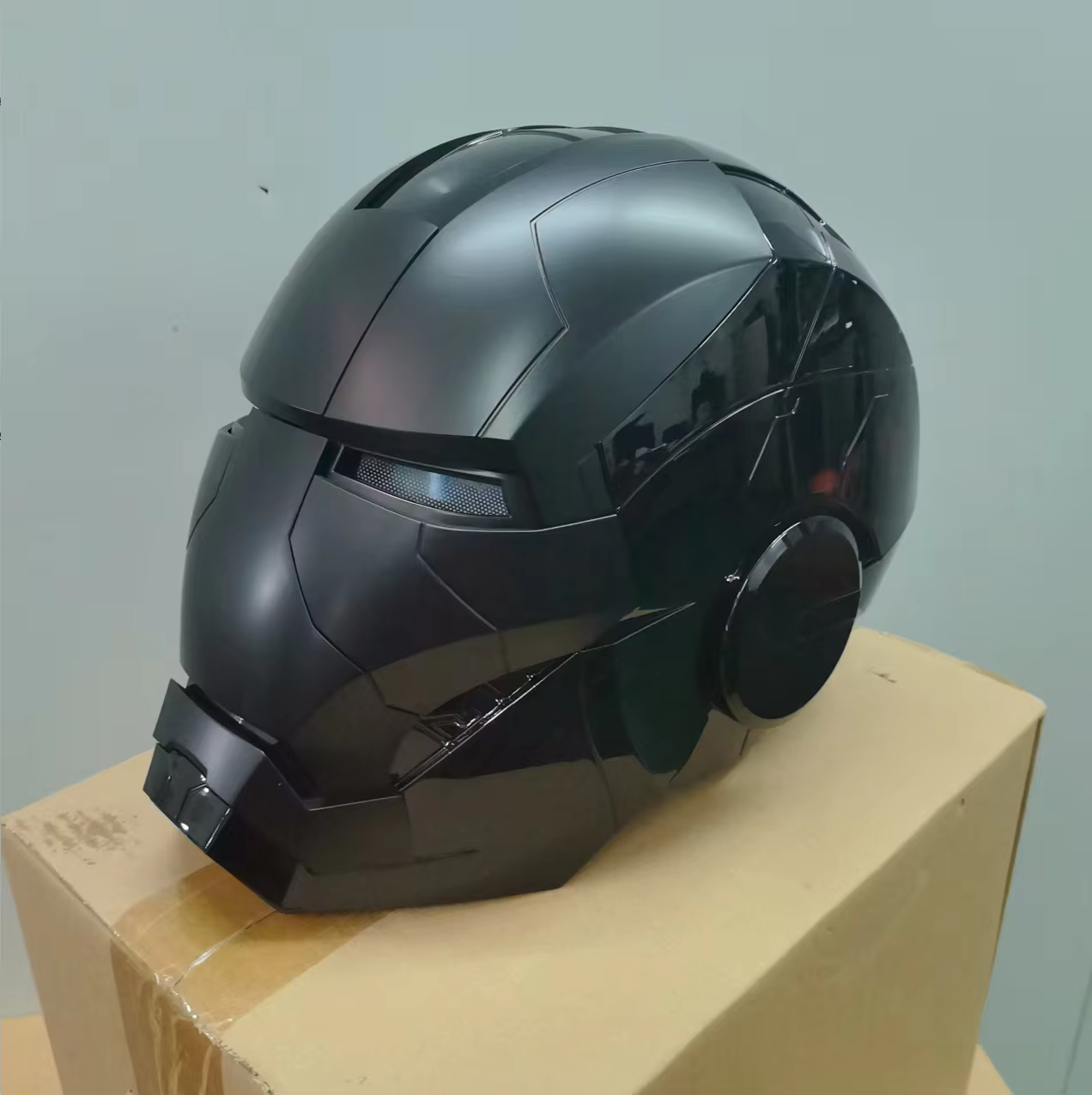Black motorcycle helmet on a wooden block Premium Iron Man Mk5 Voice Control Cosplay Helmet