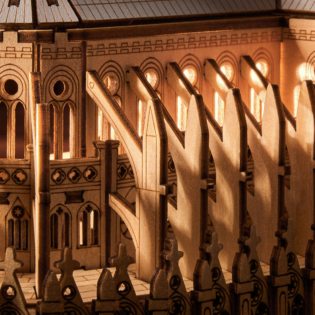 Close-up of a detailed model of a cathedral with wooden architecture.
