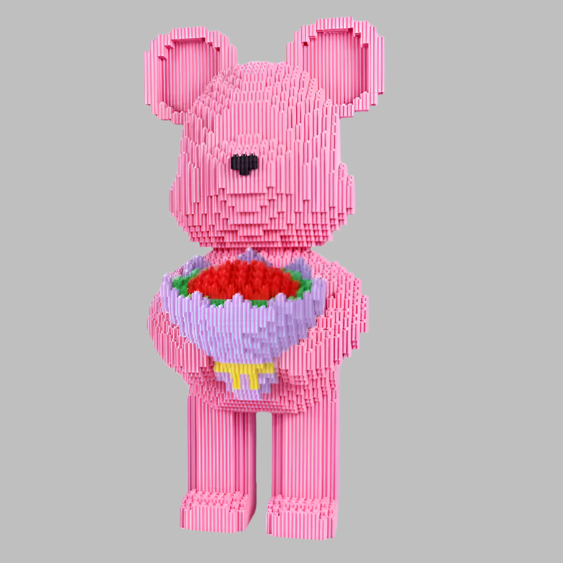 Pink bear-shaped toy holding a bouquet of flowers on a gray background
