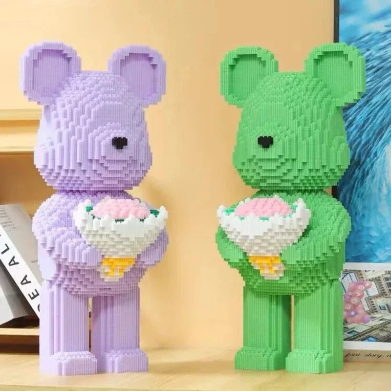 Two bear-shaped toys, one purple and one green, holding flower baskets on a wooden surface.