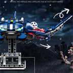 Toy robot with movable wings on a dark underwater background