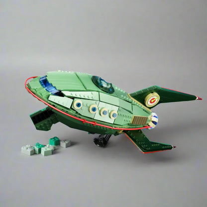 Toy spaceship building blocks set against a space-themed background with text and icons.