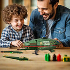 Man and child playing with a toy spaceship on a table, with 'Gift for Spaceship Fans' text at the bottom.