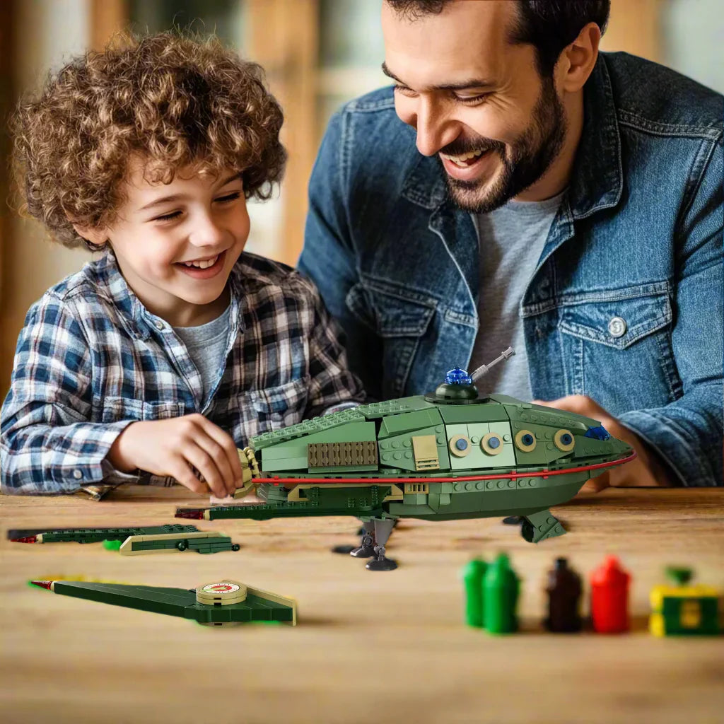 Man and child playing with a toy spaceship on a table, with 'Gift for Spaceship Fans' text at the bottom.