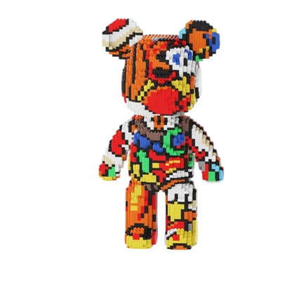 Colorful teddy bear building block set on a white platform with gift boxes in the background