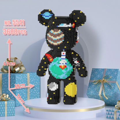 Black bear-shaped toy made of building blocks with measurements and gift boxes in the background