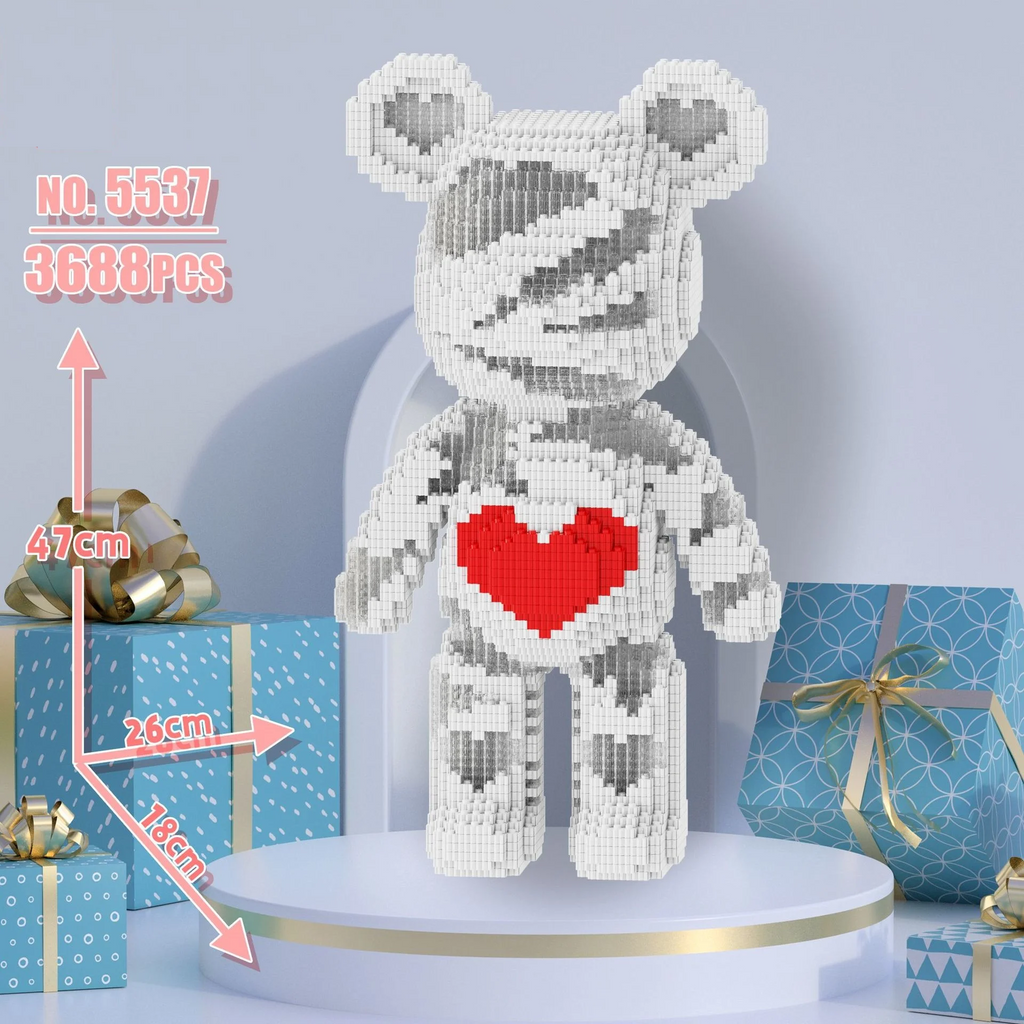 White bear-shaped decorative item with a red heart on a blue background