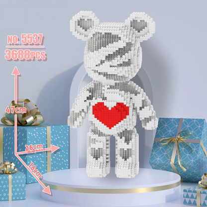 White bear-shaped decorative item with a red heart on a blue background