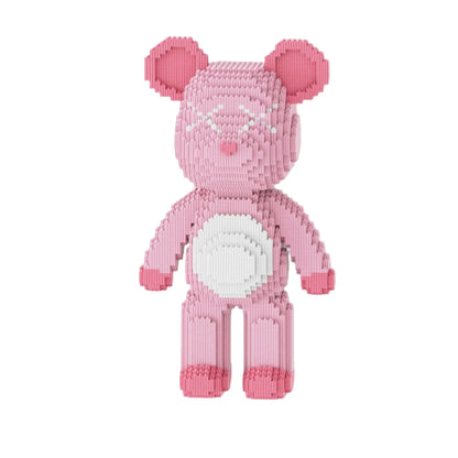 Pink teddy bear toy made of building blocks with measurements and packaging in the background