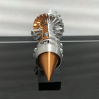 Close-up of a metallic object with a cone-shaped tip on a gray background